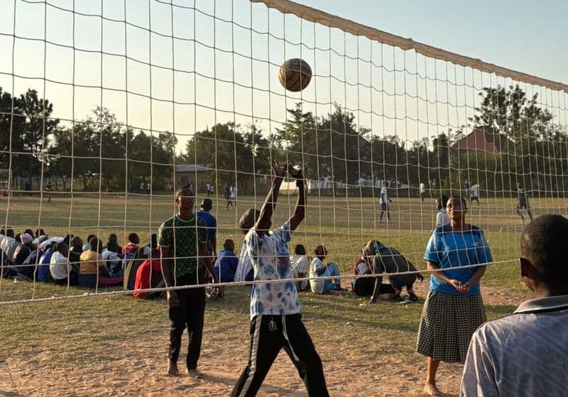 Students competing at the net during a volleyball game at Bidii Schools